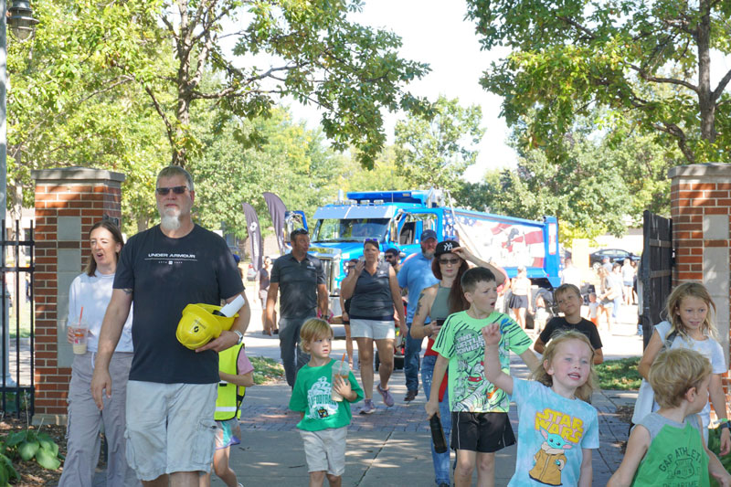 Children and families enter the gates at Touch a Truck down at the Leach Amphitheater
